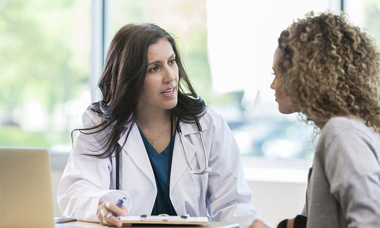 Doctor speaking with patient